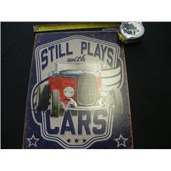 Still plays with cars tin sign