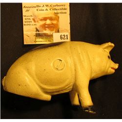 Old 1933 era Cast Iron Hog Bank, some change included.2 1/2" x 4 1/2".
