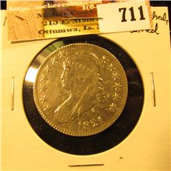 1821 Capped Bust Half Dollar, scratched and cleaned, otherwise VF-EF.