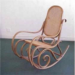 Thonet Furniture, BENTWOOD ROCKER, with cane back and seat, round head screws and dowels, stamp...