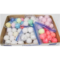 FLAT OF COLORED RECLAIMED GOLF BALLS.