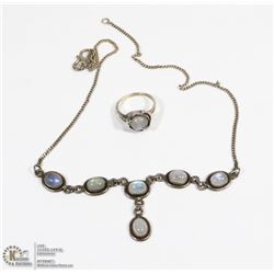 ART DECO SILVER HAND HOLDING MOONSTONE RING