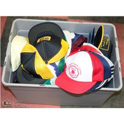 BOX FULL OF VINTAGE TRUCKER HATS.