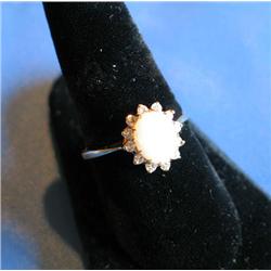 RING W/OPAL CENTER STONE SURROUNDED BY DIAMON