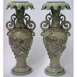 A pair of earthenware handled vases, leaf dra