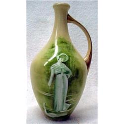 Heubach ewer with hand painted figure of a ma