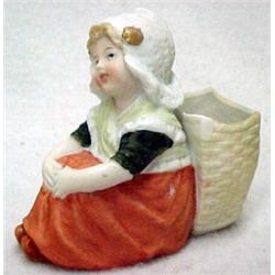 Heubach seated Dutch girl with "basket" spill