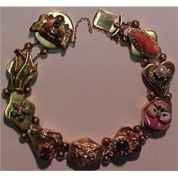 14K gold slide bracelet comprised of nine lar