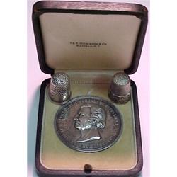 Medal in fitted box and two sterling silver t