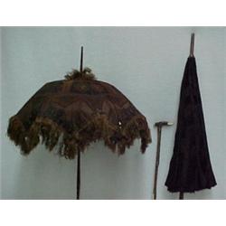 Two parasols and a riding crop, brown and bla