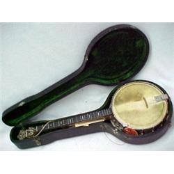 Banjo, four strings, bird's eye maple shell,