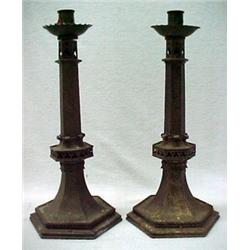 A pair of bronze Cathedral candlesticks, poin