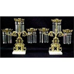 A pair of girandoles, each with triple candle