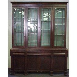 Walnut veneer bookcase on cabinet, molded ove
