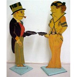 A pair of painted wooden figural card holders