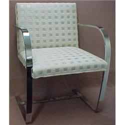 A pair of stainless steel flatbar and upholst