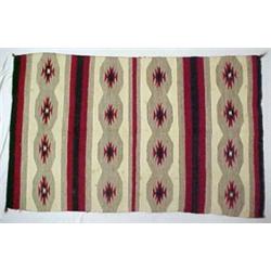 Navajo rug, in brown, red, grey and cream, C.