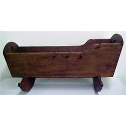 Pine cradle, original red paint, cut-outs on