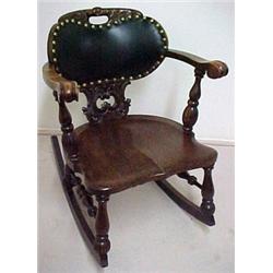 Oak rocker, carved crest rail with cut-out ha