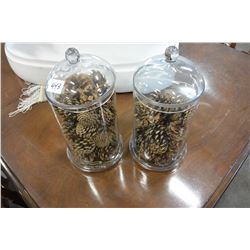 TWO GLASS LIDDED CONTAINERS WITH DECORATIVE PINECONES