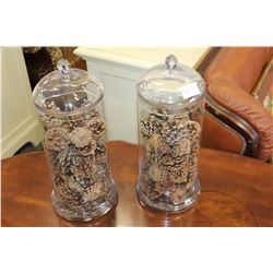 TWO GLASS LIDDED CONTAINERS WITH DECORATIVE PINECONES