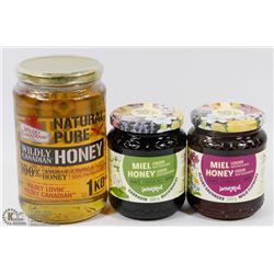 FLAT W/ ASSORTED JARS OF HONEY.