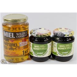 FLAT W/ ASSORTED JARS OF HONEY.