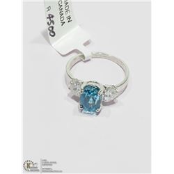8) 14KT W.GOLD BLUE ZIRCON RING W/2 SIDE DIAMONDS