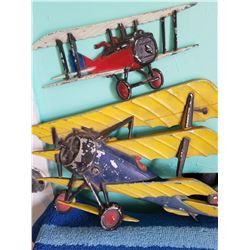 Pair of aluminum bi-planes dated 1975