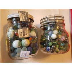 2 jars of marbles lots of mini. Some rare and some large.