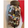 Image 1 : big jar of rare marbles in blue ribbon coffee jar