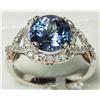 Image 2 : 14K WHITE GOLD TANZANITE (3.20CT) AND 46 DIAMOND (0.46CT) HALO TWIST RING. INSURANCE VALUE $6500