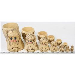 A SET OF 7 RUSSIAN NESTING DOLLS (MATRIOSHKAS)