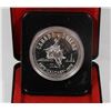 Image 1 : 1975 CANADIAN SILVER DOLLAR IN DISPLAY