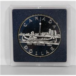 1984 UNCIRCULATED CANADIAN SILVER DOLLAR IN DISPLAY
