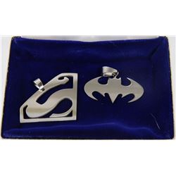 LOT OF SUPERMAN AND BATMAN SYMBOL PENDANTS