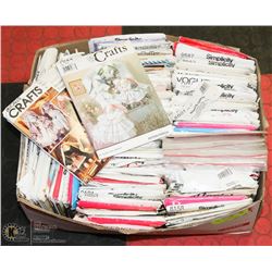 BOX OF SEWING PATTERNS.