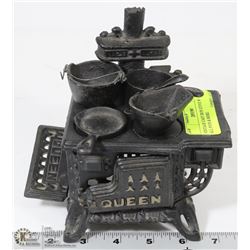 VINTAGE CAST IRON STOVE WITH ALL POTS & MORE.