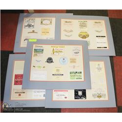 5 DISPLAYS OF VINTAGE ALCOHOL LABELS.