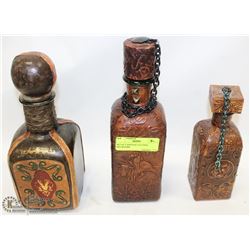 SET OF 3 VINTAGE LEATHER DECANTERS