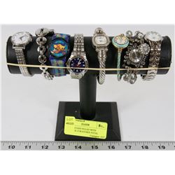 BLACK STAND FILLED WITH WATCHES- 8 WATCHES TOTAL.