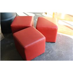 THREE LEATHER OTTOMANS