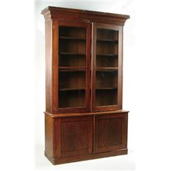 Lot# 52  TWO PART VICTORIAN STEP BACK WALNUT BOOKCASE.  