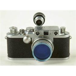 Lot# 99  CAMERA: LEICA CAMERA. Leitz 1:2 lens 5cm.  Serial No. NR.665603. With two Leica hard cover 