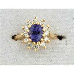 Lot# 297  14K YELLOW GOLD TANZANITE AND DIAMOND RING.  
