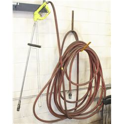 ROLL OF 1 INCH DIAMETER HOSE WITH SPRAY WAND