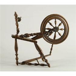 Lot #  528A.:  MINIATURE CARVED WOOD SPINNING WHEEL.