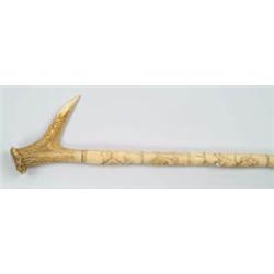 Lot #  541:  CANE: CARVED IVORY AND STAG HORN CANE.