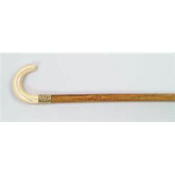 Lot #  587:  CANE: IVORY C-HANDLED PRESENTATION CANE.