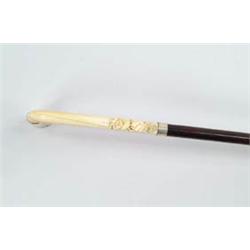Lot #  589:  CANE: FINE CARVED IVORY, SILVER AND ROSEWOOD CANE.